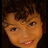 Sir Messiah joined the competition — help win amazing prizes! child, curly_hair, smiling, face, portrait, happy, eyes, person, closeup, cute, young, expression, black_clothing, dark_background, teeth, skin, head, hair, childhood, innocence