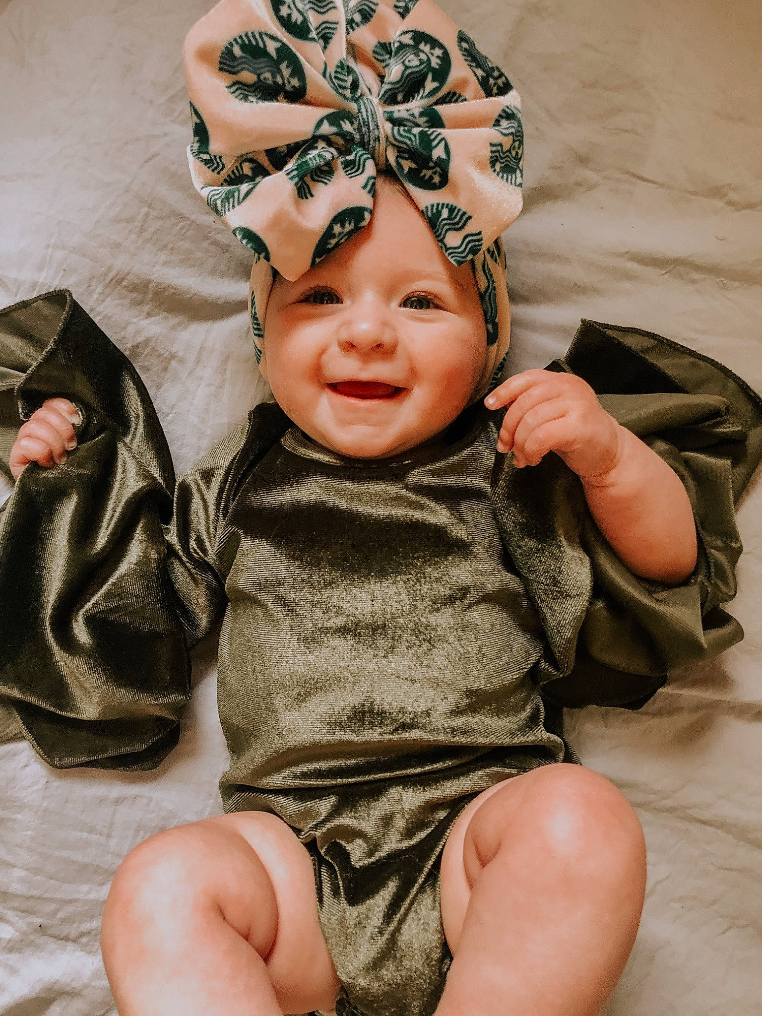 Lakelynn is registered to the contest to win money with this photo: baby, baby_toddler_clothing, child, comfort, face, fashion_accessory, happy, head, headband, headgear, headpiece, headwear, human_leg, joy, pattern, person, personal_protective_equipment, skin, sleeve, smile