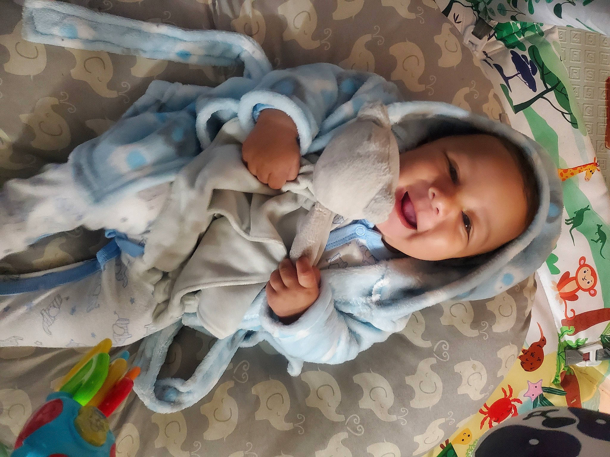 Levi is registered to the contest to win money with this photo: baby, baby_products, baby_safety, baby_toddler_clothing, bedding, bedtime, child, comfort, happy, headwear, linens, pattern, person, sleep, smile, toddler