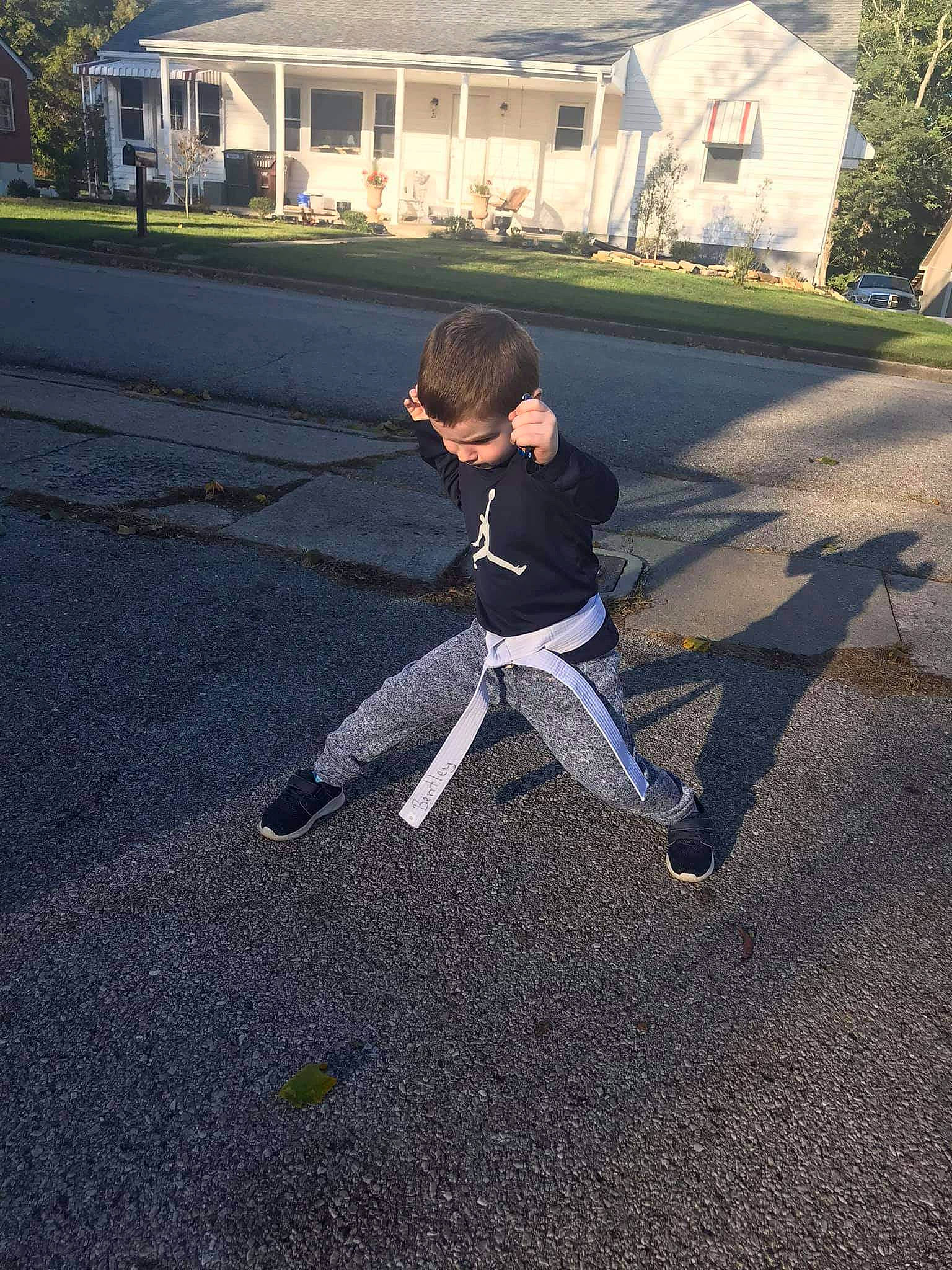 Bentley is registered to the contest to win money with this photo: asphalt, fun, person, play, recreation, road, tree