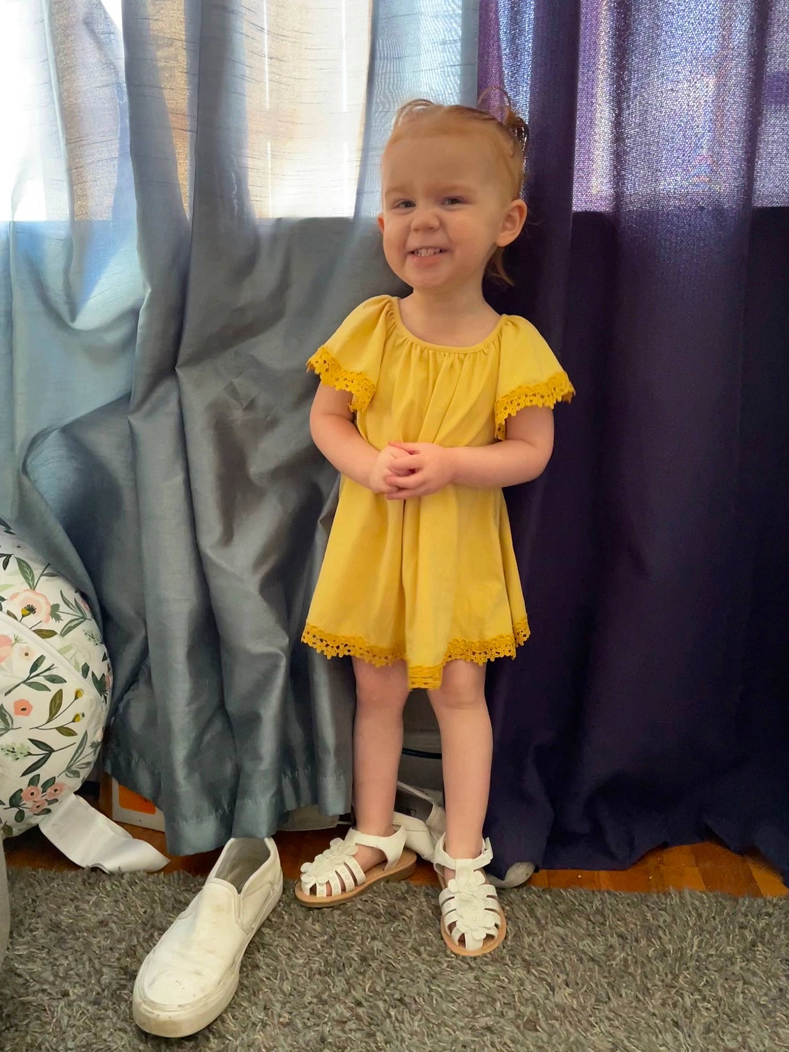 Isla is registered to the contest to win money with this photo: baby, baby_toddler_clothing, beauty, child, comfort, couch, curtain, day_dress, dress, event, floor, flooring, foot, fun, human_leg, joy, person, sandal, sleeve, smile