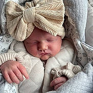 Maria participe au concours pour gagner de l'argent avec cette photo : newborn, baby, sleeping, hat, bow, knitwear, blanket, cozy, soft, infant, cute, wrapped, hands, face, peaceful, warm, child, portrait, textile, fabric