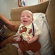 Sir Steven Pollerana joined the competition — help win amazing prizes! baby, blanket, bow_tie, casual, child, clothing, couch, family, furniture, hand, happy, indoor, infant, laughing, living_room, person, portrait, smiling, support, suspenders