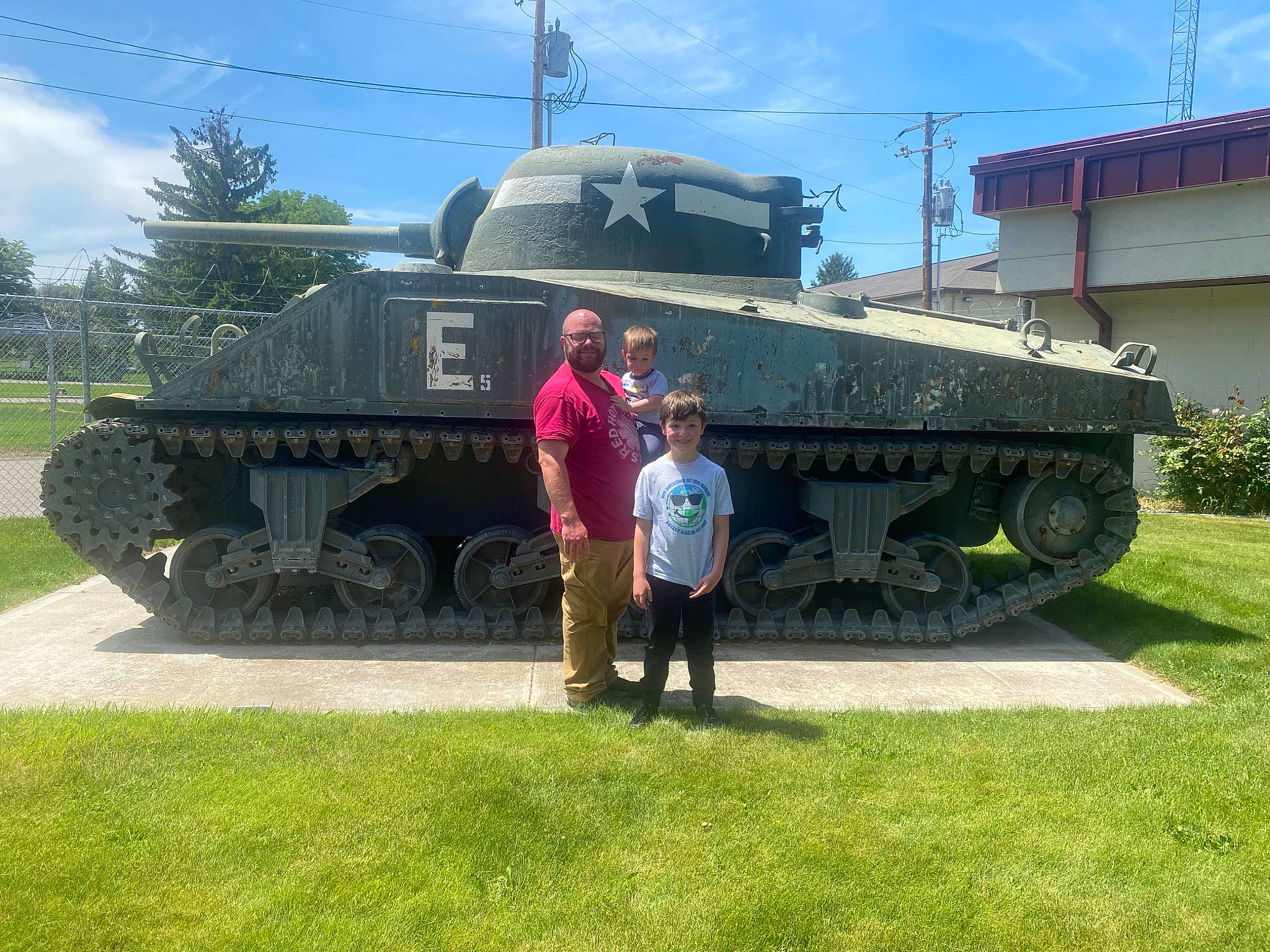 Clayton is registered to the contest to win money with this photo: armored_car, army, automotive_wheel_system, cloud, combat_vehicle, engineering, joy, land_vehicle, marines, military, military_camouflage, military_organization, military_person, military_vehicle, motor_vehicle, person, plant, self_propelled_artillery, sky, tank