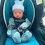 Jayden is registered to the contest to win money with this photo: baby, newborn, car_seat, blue, hat, clothing, infant, seat_belt, child, person, indoor, portrait, cute, small, stripes, fabric, safety, serious, wrapped, newborn_clothing