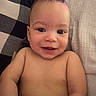 baby, infant, child, smiling, happy, portrait, face, eyes, bed, pillow, blanket, bedding, indoors, home, lying_down, bare_shoulders, skin, cozy, close_up, photography