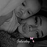 Kylo is registered to the contest to win money with this photo: child, adult, selfie, portrait, black_and_white, cuddling, sleepy, indoor, bedroom, blanket, rug, closeup, faces, eyes, nose_ring, butterfly, saturday, text_overlay, cozy, family
