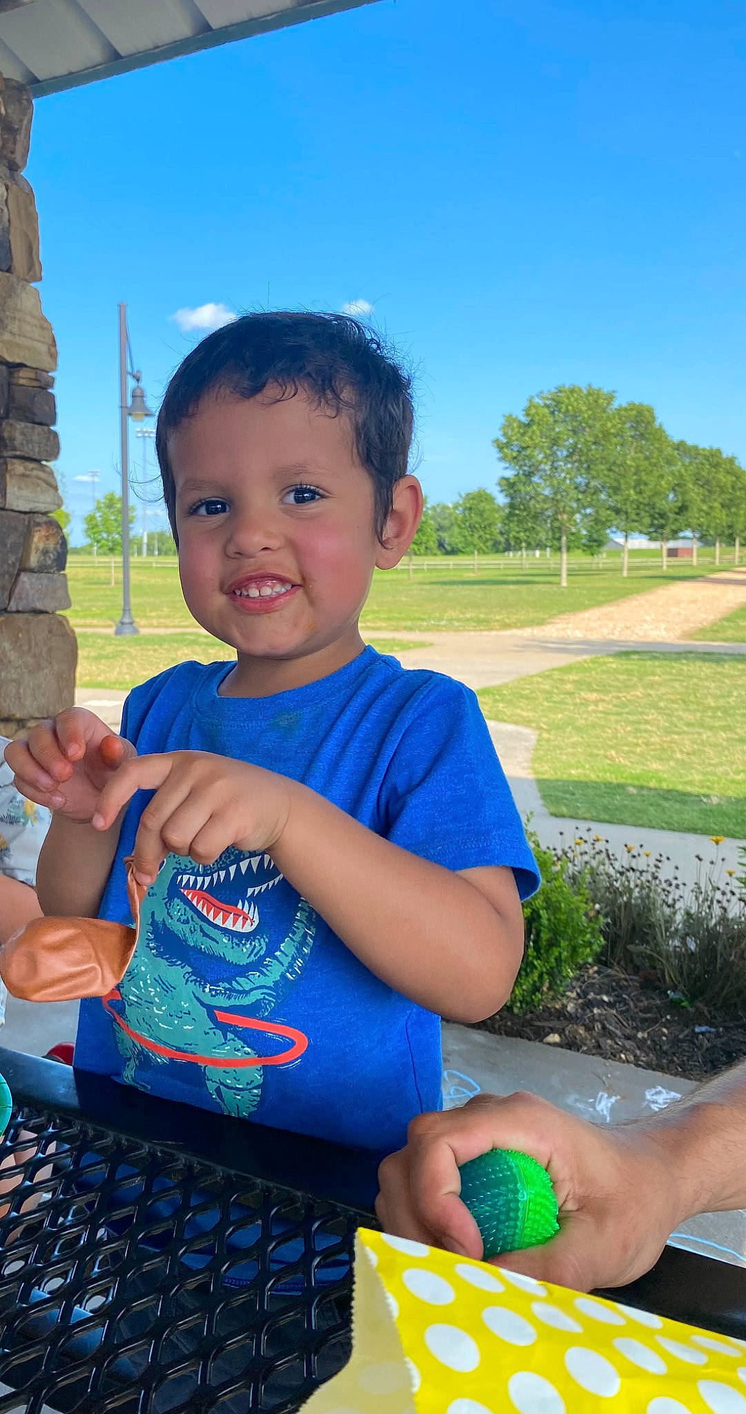 Jaxton is registered to the contest to win money with this photo: blue, computer_keyboard, electric_blue, finger, fun, grass, green, hand, happy, input_device, joy, leisure, peripheral, person, plant, recreation, sky, t_shirt, tableware, thumb