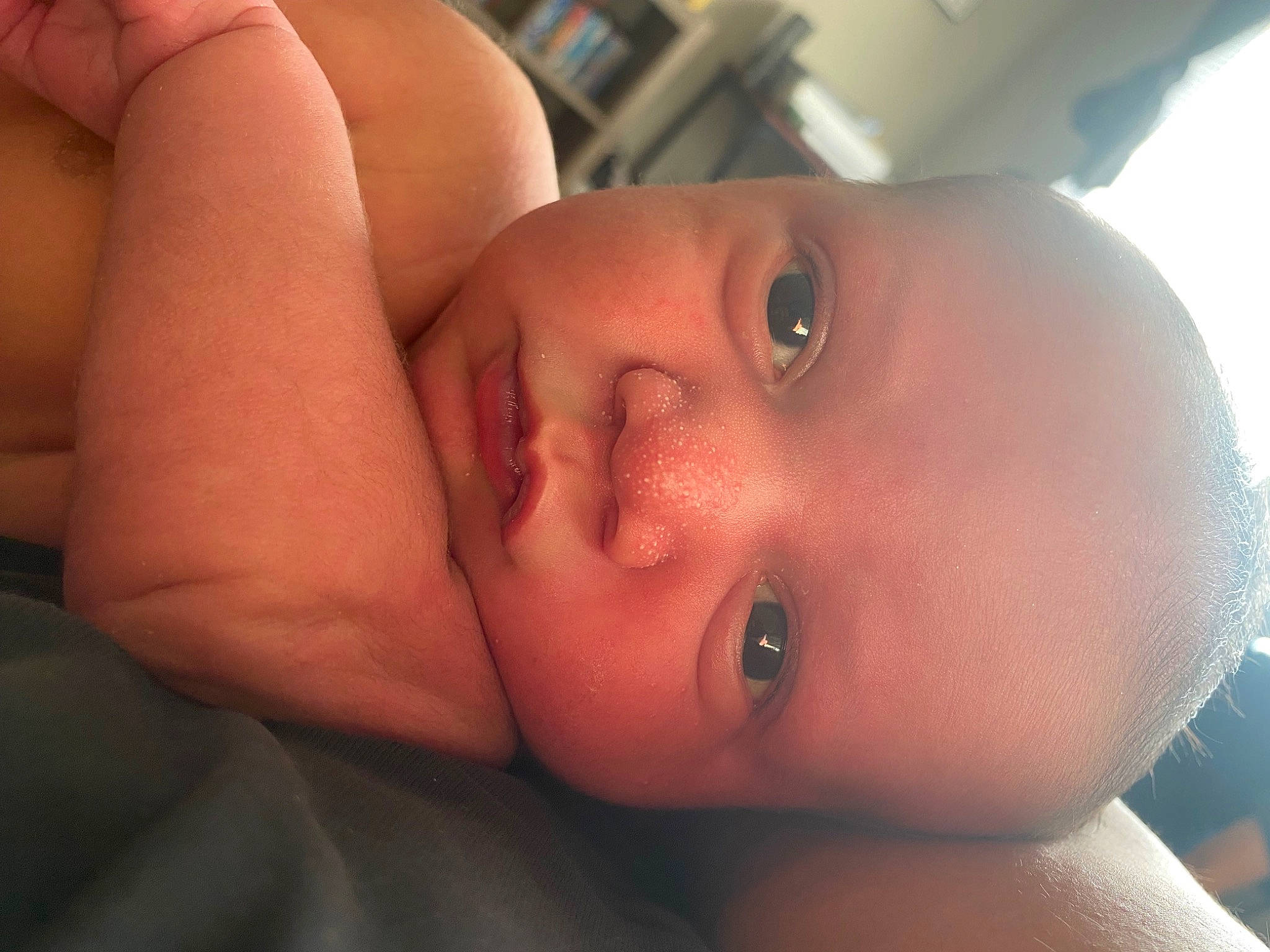 Karson is registered to the contest to win money with this photo: arm, baby, cheek, chest, comfort, ear, eyelash, finger, forehead, hand, human_body, iris, lip, mouth, muscle, neck, nose, person, skin, smile