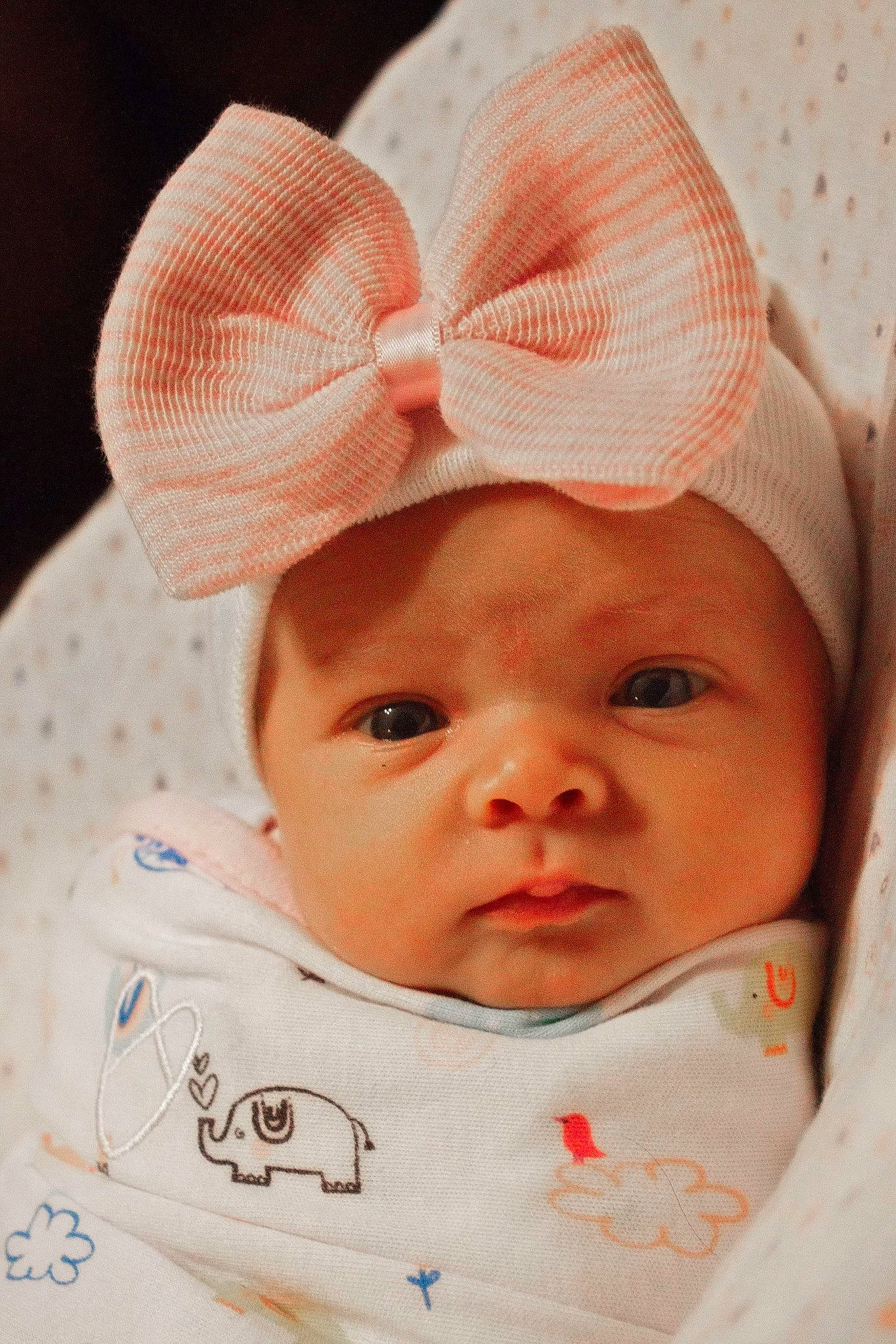 Evalyn is registered to the contest to win money with this photo: baby, bonnet, cheek, child, ear, face, fashion_accessory, forehead, head, headgear, lip, person, pink, skin, smile, toddler