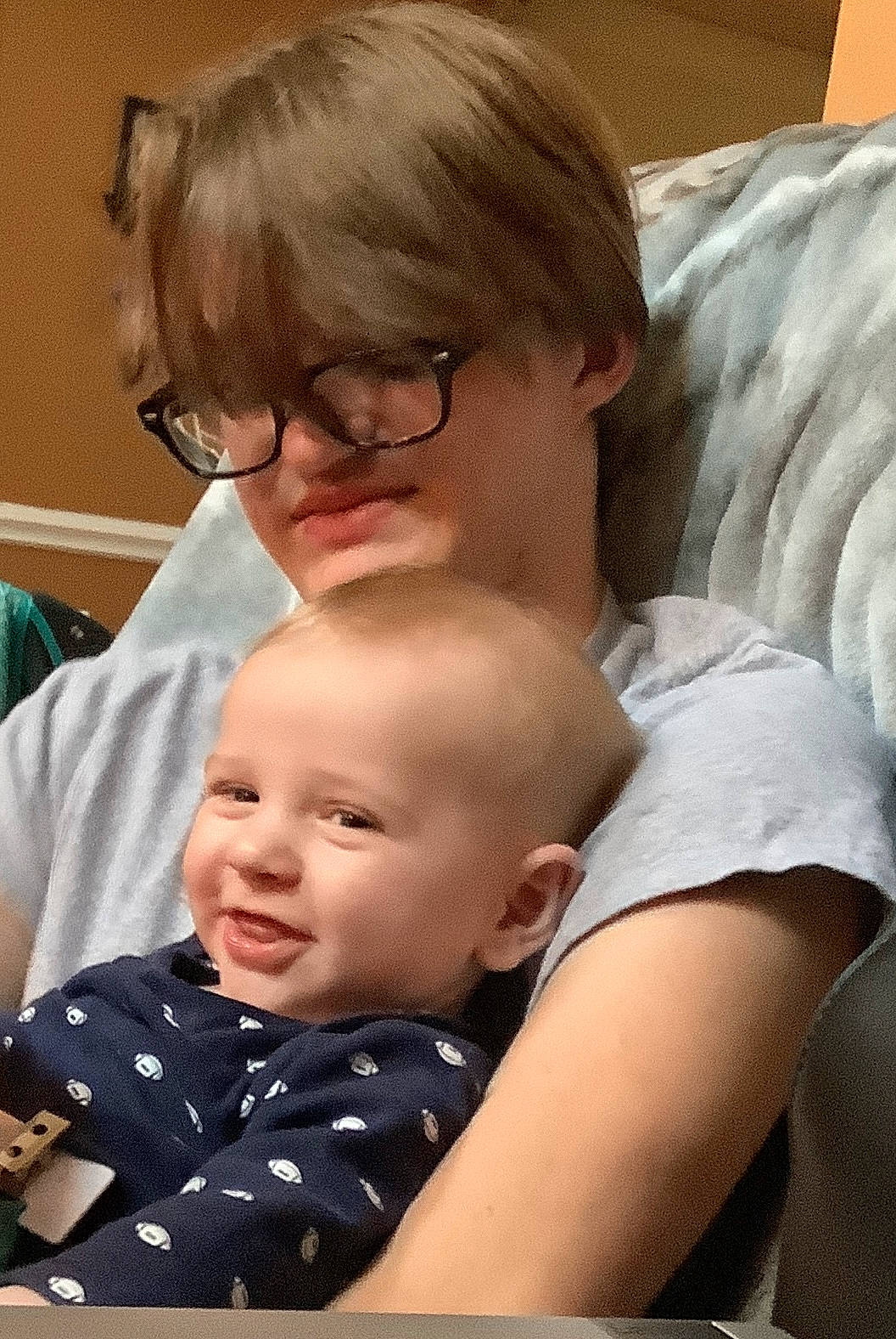 Erik joined the competition — help win amazing prizes! baby, cheek, child, comfort, couch, eyewear, facial_expression, fun, glasses, happy, hug, iris, mouth, nose, people, person, room, sitting, t_shirt, toddler