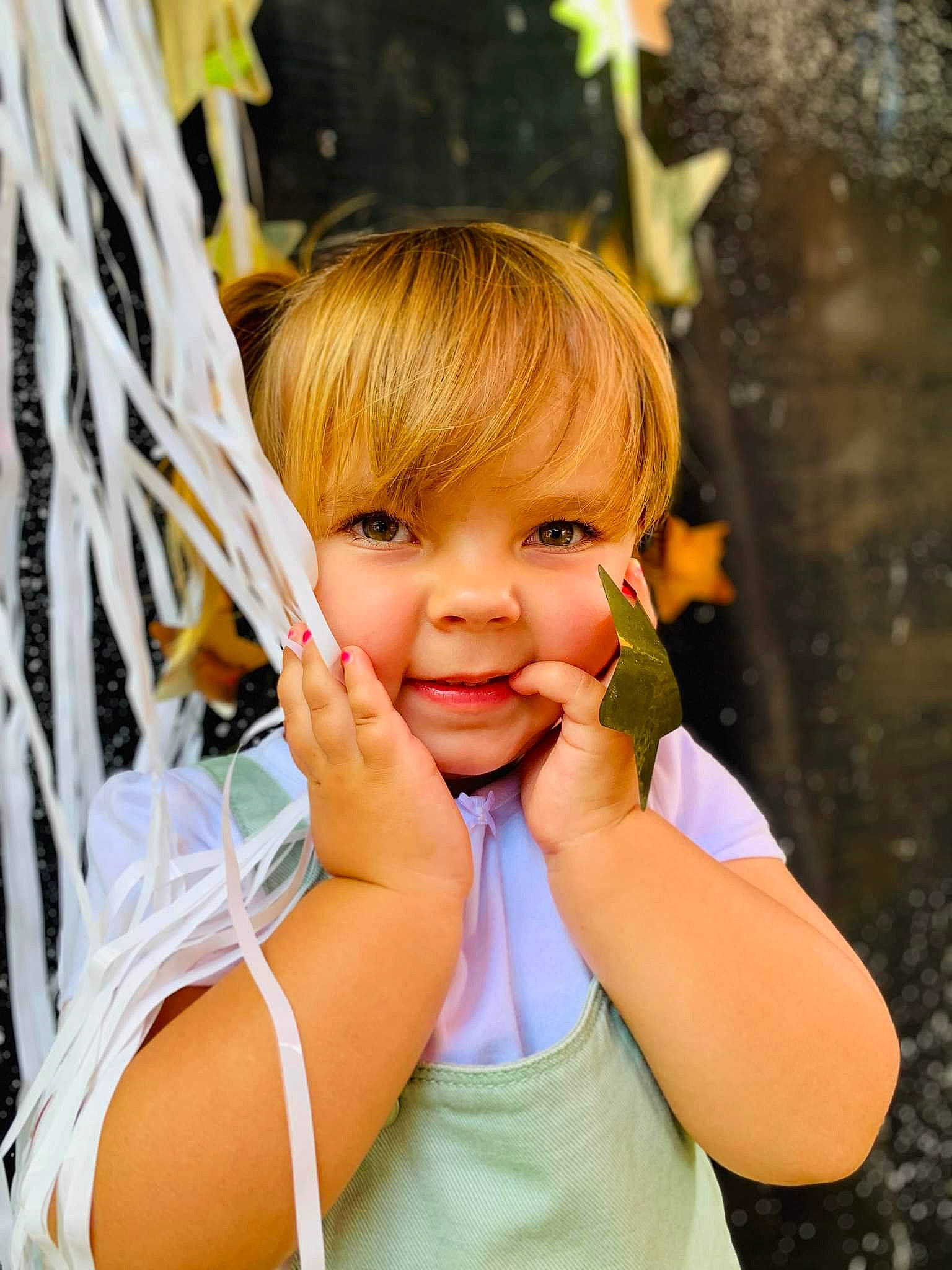 Briella is registered to the contest to win money with this photo: arm, bangs, blond, child, eyelash, finger, fun, gesture, grass, hair, hand, happy, leisure, lip, people_in_nature, person, recreation, smile, spring, thumb