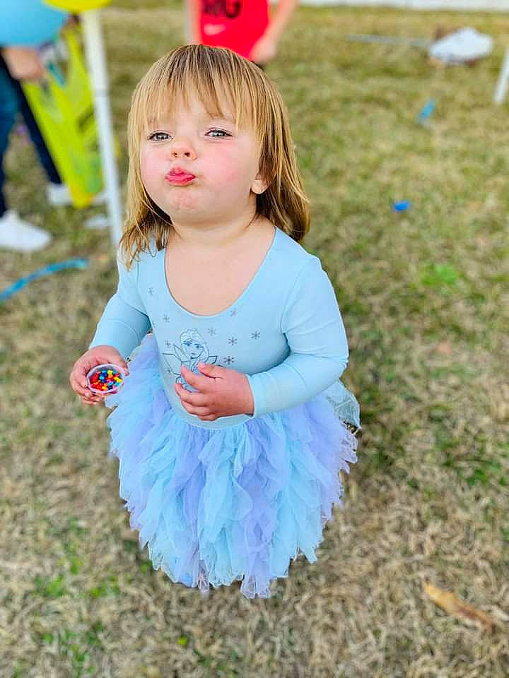 Briella joined the competition — help win amazing prizes! baby_toddler_clothing, eye, facial_expression, fun, grass, green, hairstyle, happy, iris, leaf, nature, people_in_nature, person, pink, plant, sleeve, standing, summer, toddler, tree