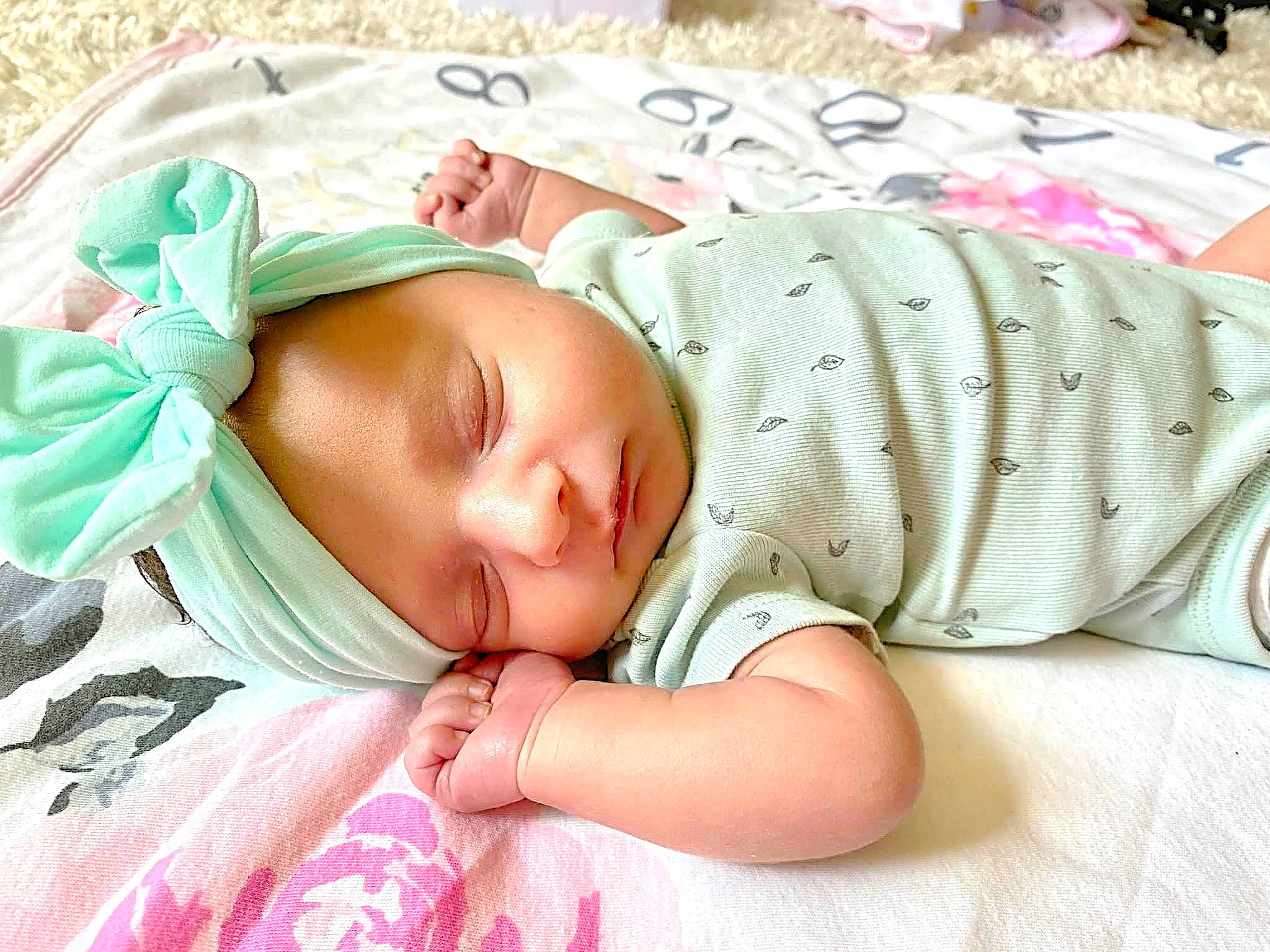 Amira joined the competition — help win amazing prizes! baby, baby_products, baby_sleeping, baby_toddler_clothing, cheek, child, comfort, eye, face, finger, grass, hand, head, headgear, linens, mammal, pattern, person, skin, sleeve