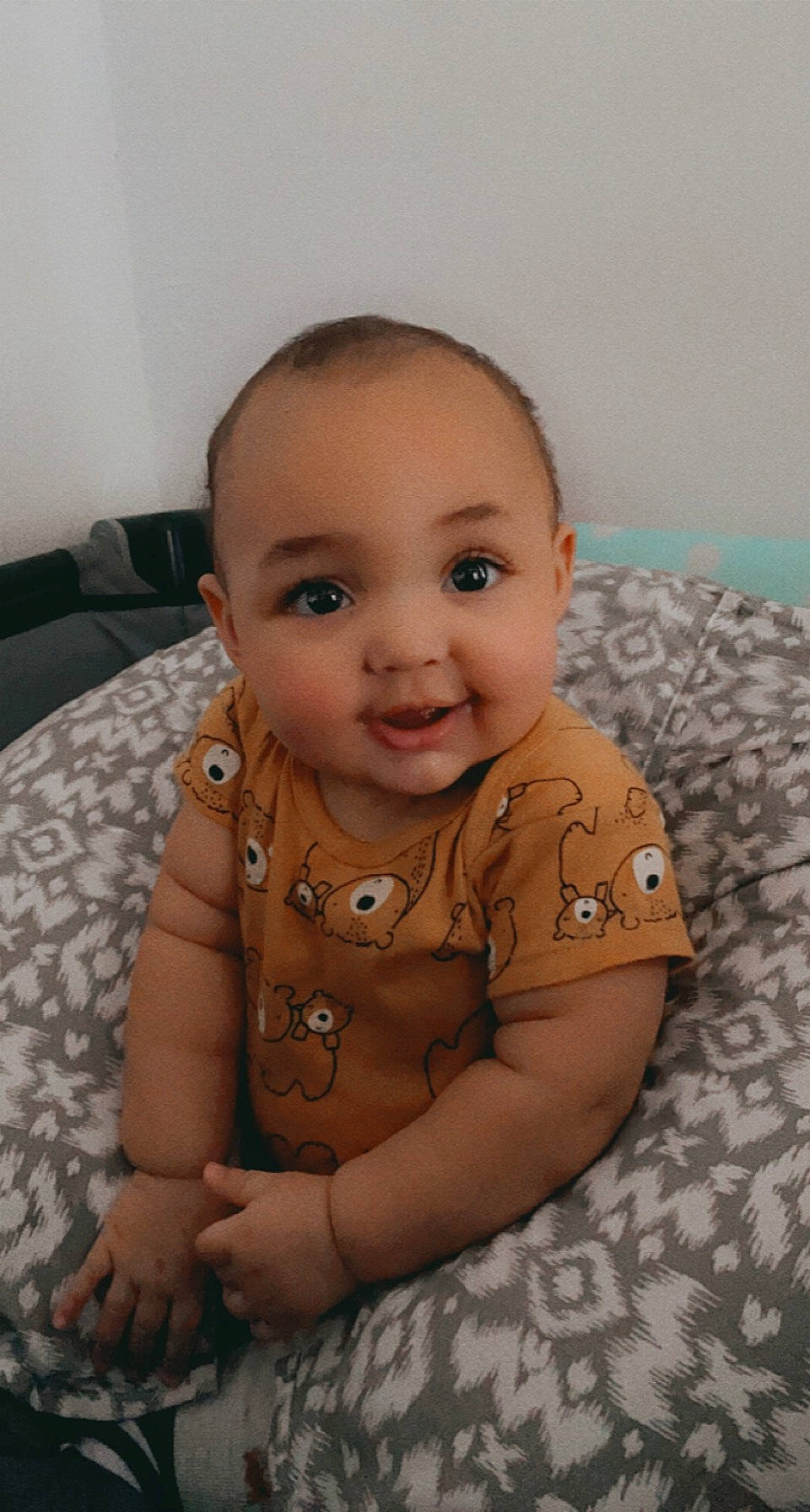 Myles is registered to the contest to win money with this photo: arm, baby, baby_toddler_clothing, cheek, chin, comfort, floor, flooring, gesture, hairstyle, happy, iris, joy, lip, mouth, nose, person, skin, sleeve, smile