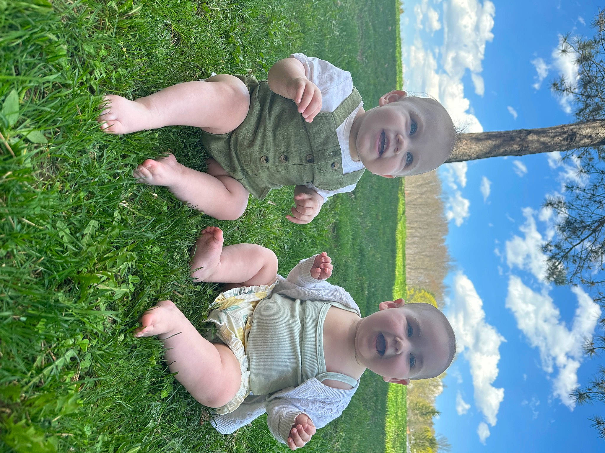 Charlotte is registered to the contest to win money with this photo: baby, baby_toddler_clothing, child, cloud, fun, gesture, grass, grassland, happy, leisure, people, people_in_nature, person, plant, recreation, sky, smile, spring, toddler, tree