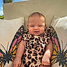 Dixianna joined the competition — help win amazing prizes! baby, blue_sky, butterfly, child, clothing, clouds, couch, cute, furniture, happy, home, infant, leopard_print, nature, outdoor, pillows, portrait, sitting, smiling, sunlight