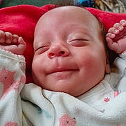 Freyja joined the competition — help win amazing prizes! baby, sleeping, smile, onesie, cozy, blanket, infant, peaceful, hands, cute, face, newborn, soft, closeup, child, comfort, warm, indoors, person, resting