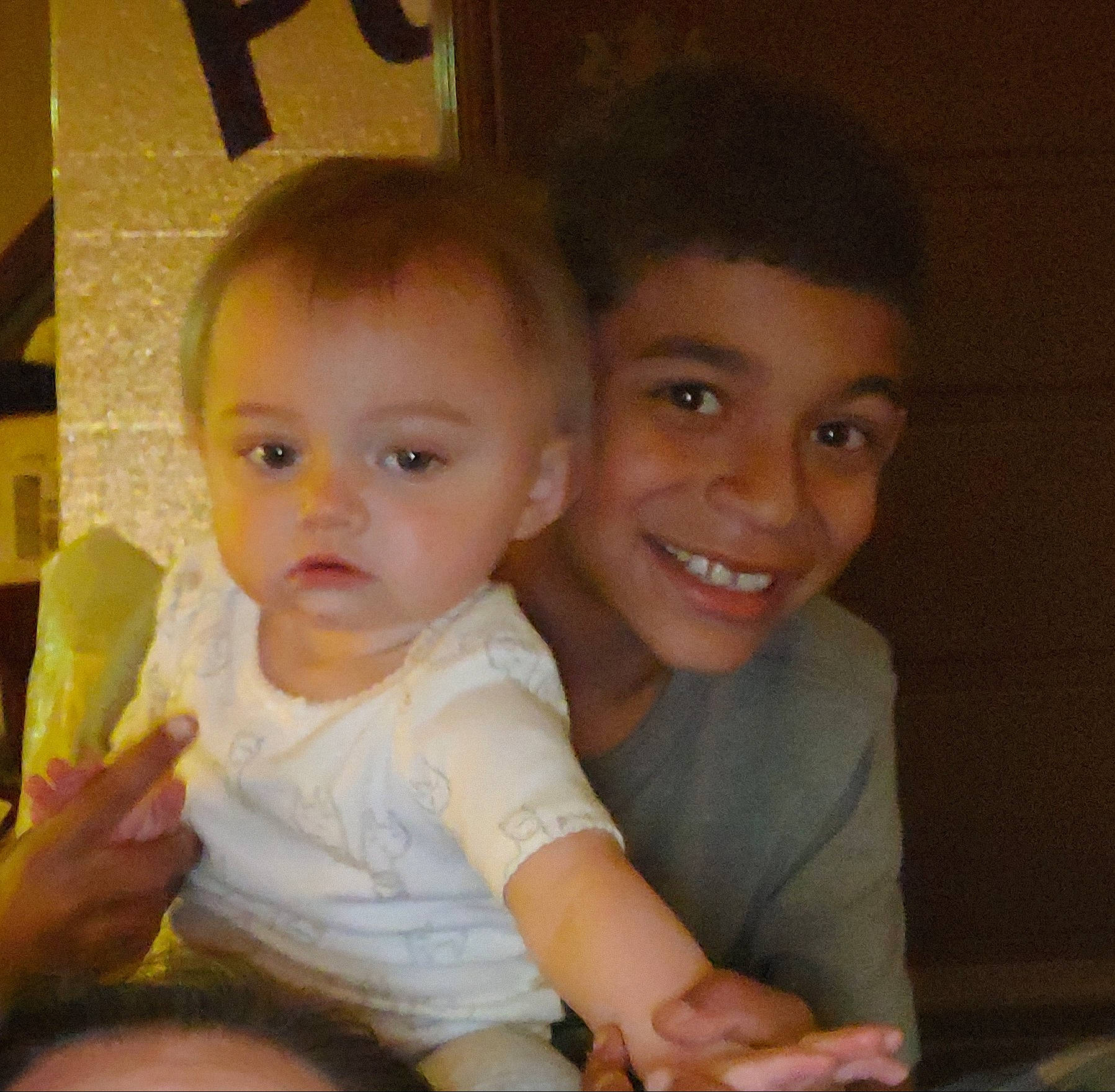 Charity is registered to the contest to win money with this photo: arm, cheek, chin, eye, face, finger, gesture, hair, hand, happy, head, iris, joy, mouth, nose, organ, person, sharing, skin, smile