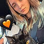 amber_eyes, animal, black_cat, candid, car, casual, cat, emoji, expressionless, hair, holding, human, passenger, pet, portrait, seat, seatbelt, vehicle_interior, woman, young_adult