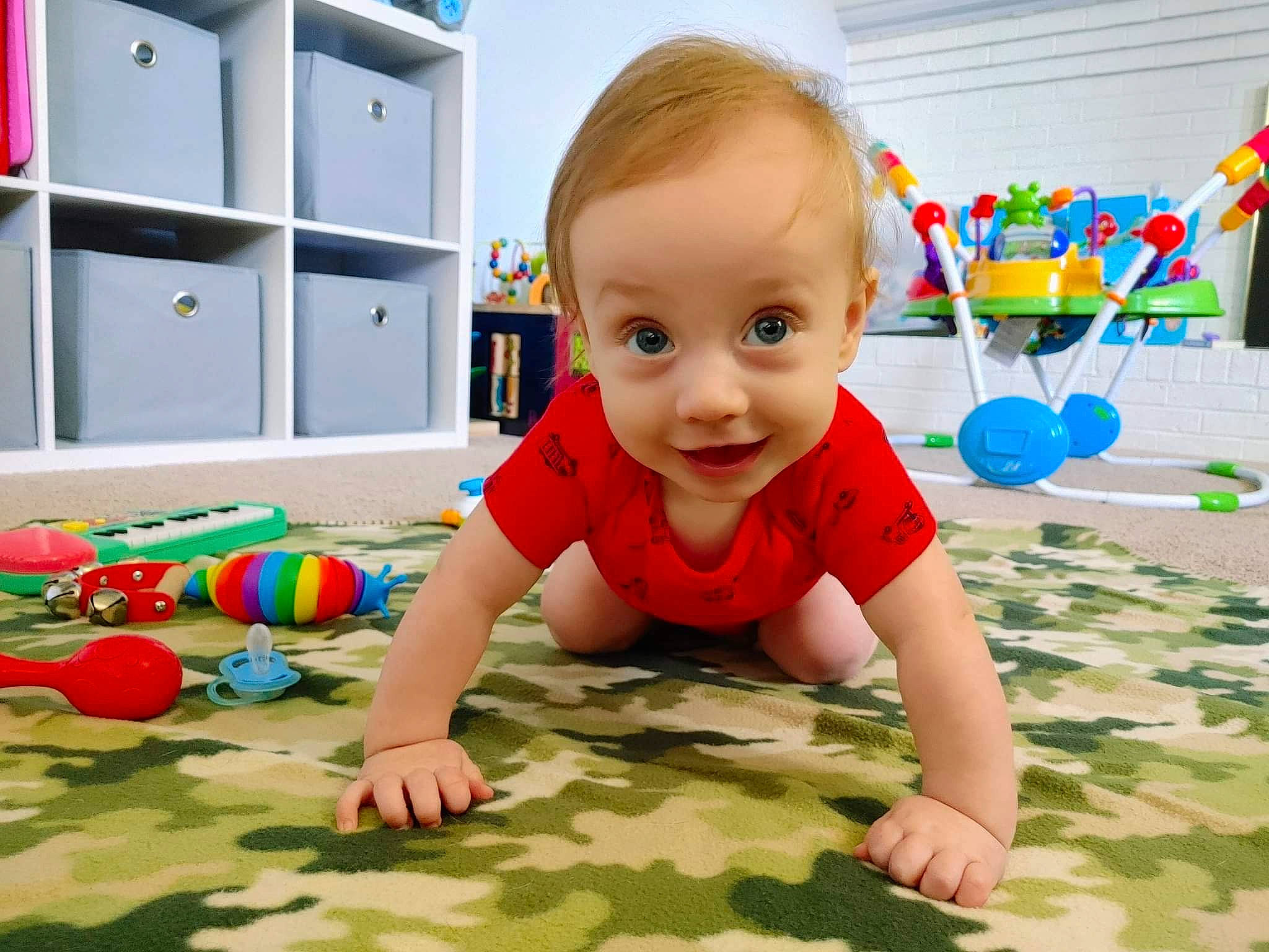 Sean joined the competition — help win amazing prizes! baby, baby_playing_with_toys, baby_toddler_clothing, baby_toys, cabinetry, child, crawling, floor, flooring, fun, grass, happy, leisure, person, play, product, smile, snapshot, standing, toddler