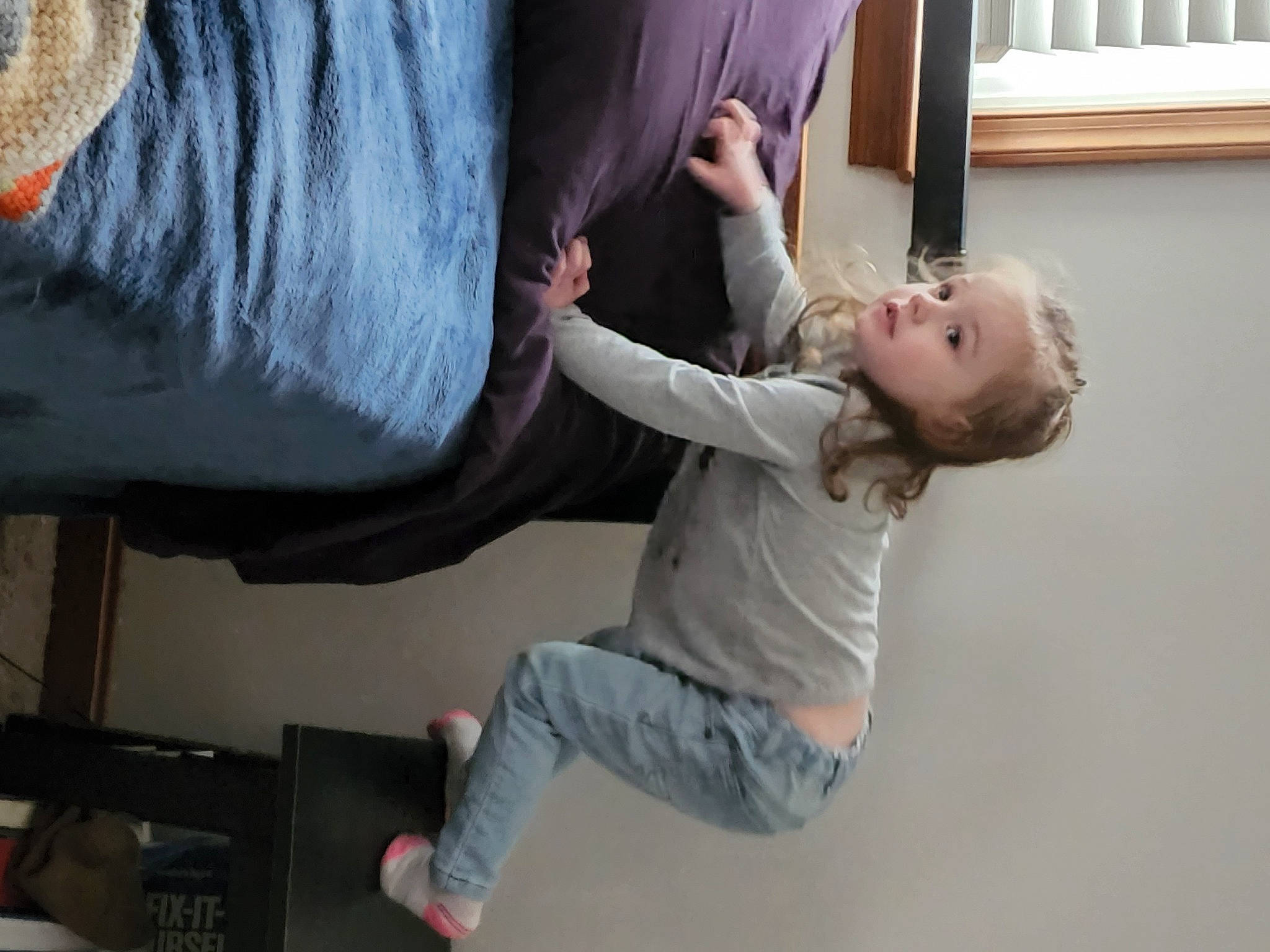 Lillian is registered to the contest to win money with this photo: arm, baby, child, comfort, elbow, finger, fun, gesture, happy, joint, knee, person, shoulder, sitting, sleeve, t_shirt, thumb, toddler, trunk, wood