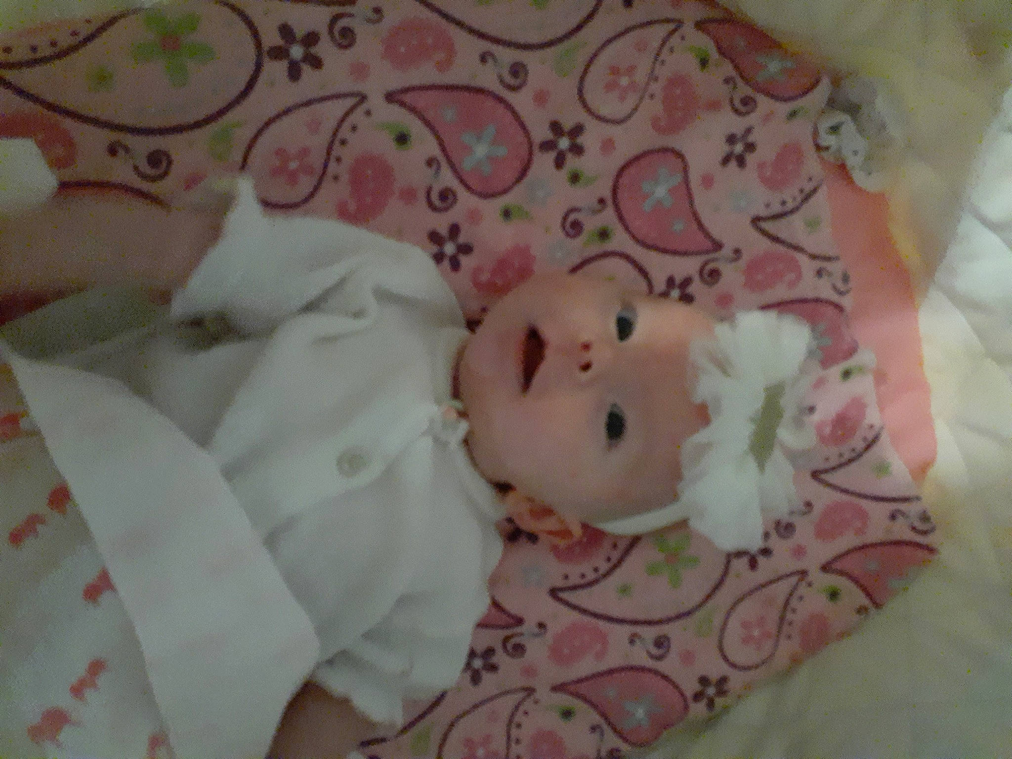 Emilia is registered to the contest to win money with this photo: baby, baby_products, bed_sheet, bedtime, blanket, cheek, child, infant_bed, linens, person, pink, product, textile