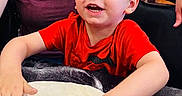 Ryder joined the competition — help win amazing prizes! child, dough, flour, table, red_shirt, smiling, adult, brick_wall, kitchen, hands, cooking, fun, happy, indoor, person, preparation, youth, playful, food, family