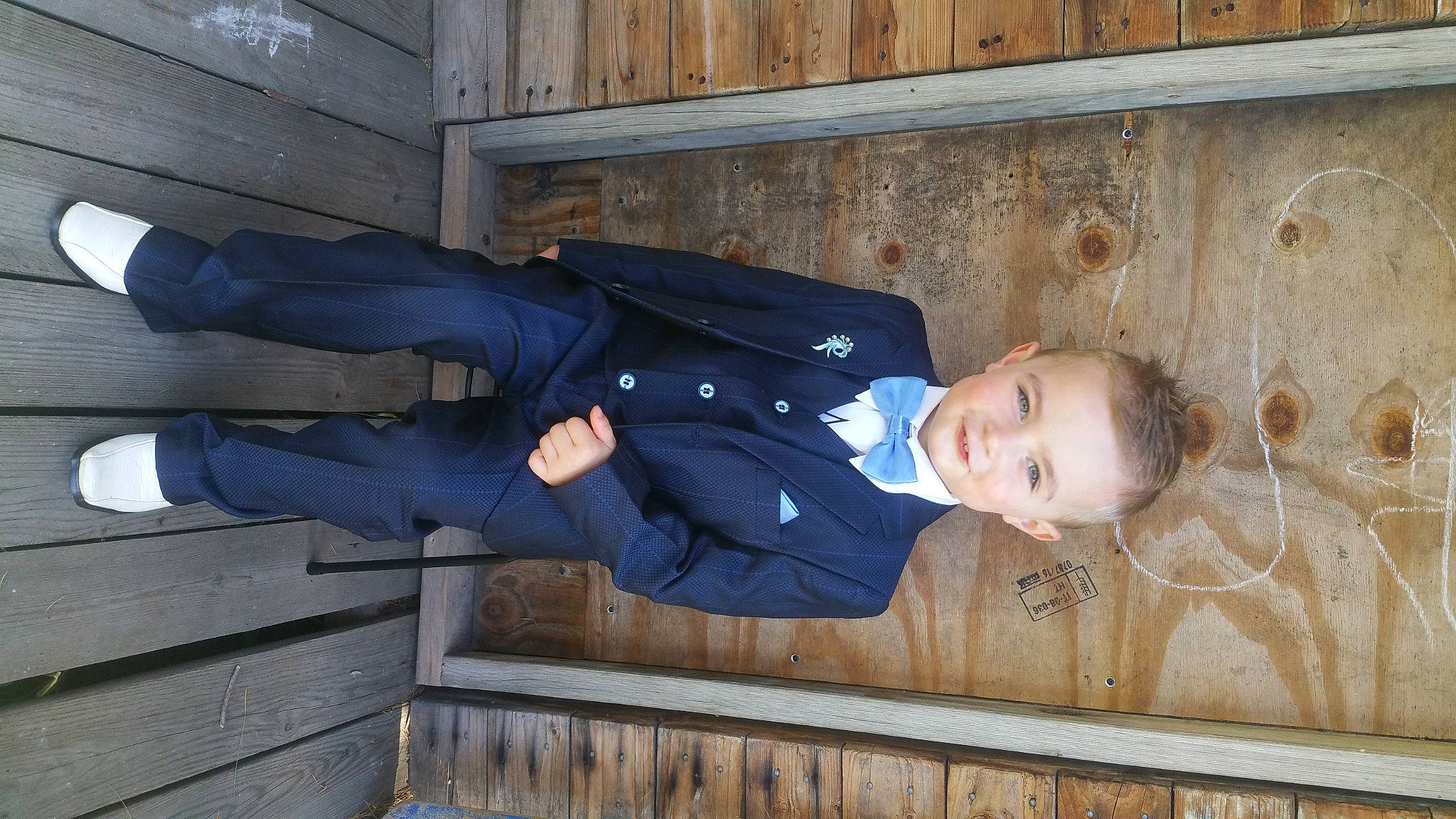 Noah joined the competition — help win amazing prizes! baby_toddler_clothing, child, clothing, collar, comfort, composite_material, electric_blue, hat, joy, person, sitting, sleeve, smile, standing, suit, toddler, windbreaker, wood