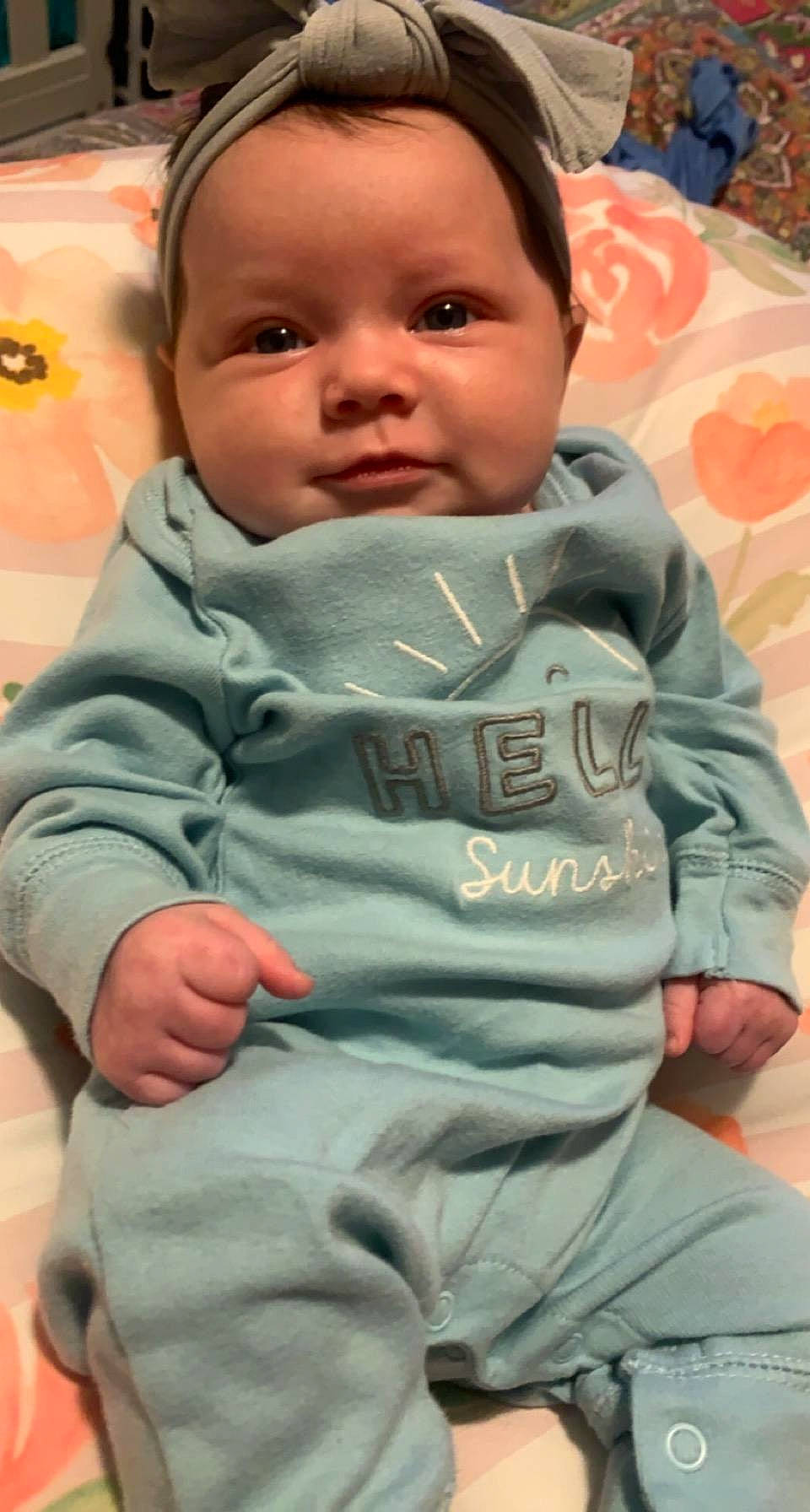 Emery is registered to the contest to win money with this photo: baby, baby_toddler_clothing, cheek, chin, comfort, eye, eyebrow, face, hair, hairstyle, head, human, human_body, lip, mouth, nose, person, skin, sleeve, smile