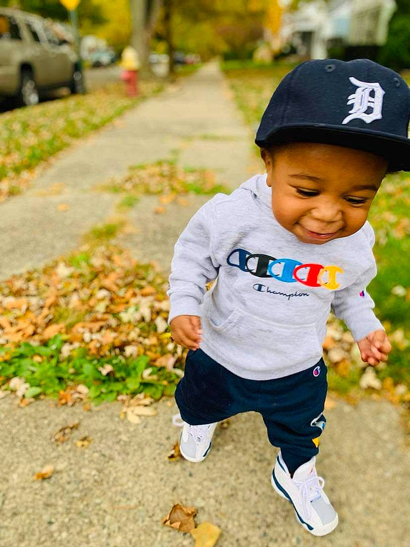 A'King joined the competition — help win amazing prizes! baby, baby_toddler_clothing, baseball_cap, cap, child, fashion_accessory, grass, happy, hat, headwear, joy, leisure, people_in_nature, person, plant, recreation, sitting, sleeve, smile, t_shirt