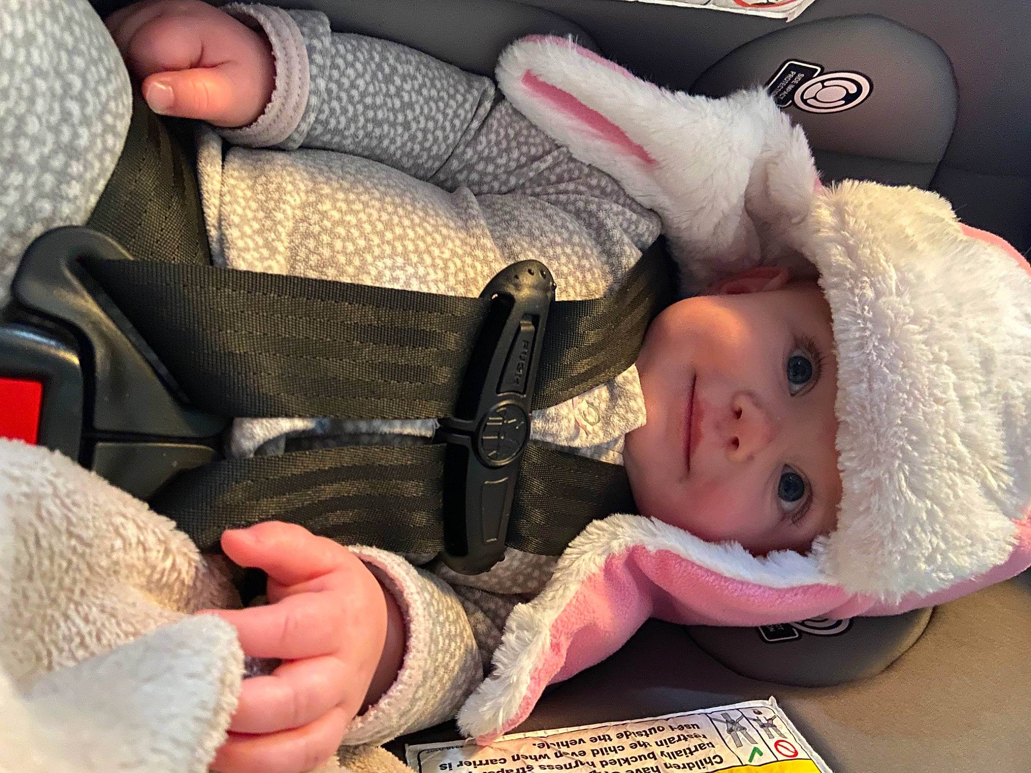 Dani joined the competition — help win amazing prizes! baby, baby_carriage, baby_products, baby_sleeping, baby_toddler_clothing, cap, car_seat, cheek, child, comfort, fashion_accessory, finger, gesture, headwear, nail, person, sitting, skin, steering_wheel, textile