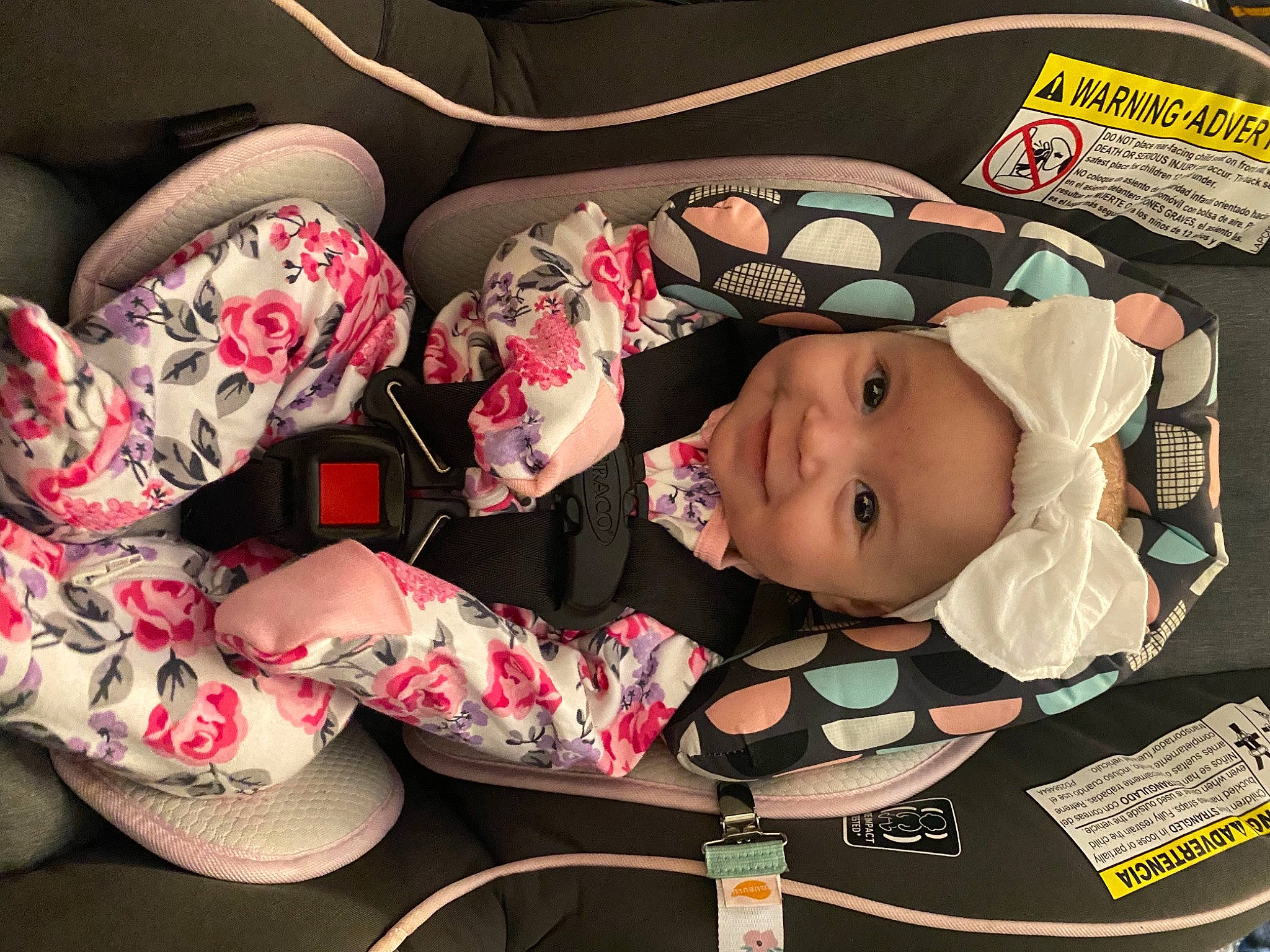 Elodie joined the competition — help win amazing prizes! auto_part, baby, baby_carriage, baby_products, baby_toddler_clothing, car_seat, carmine, child, comfort, fashion_accessory, hat, headgear, headwear, human_leg, joy, linens, pattern, person, pink, smile