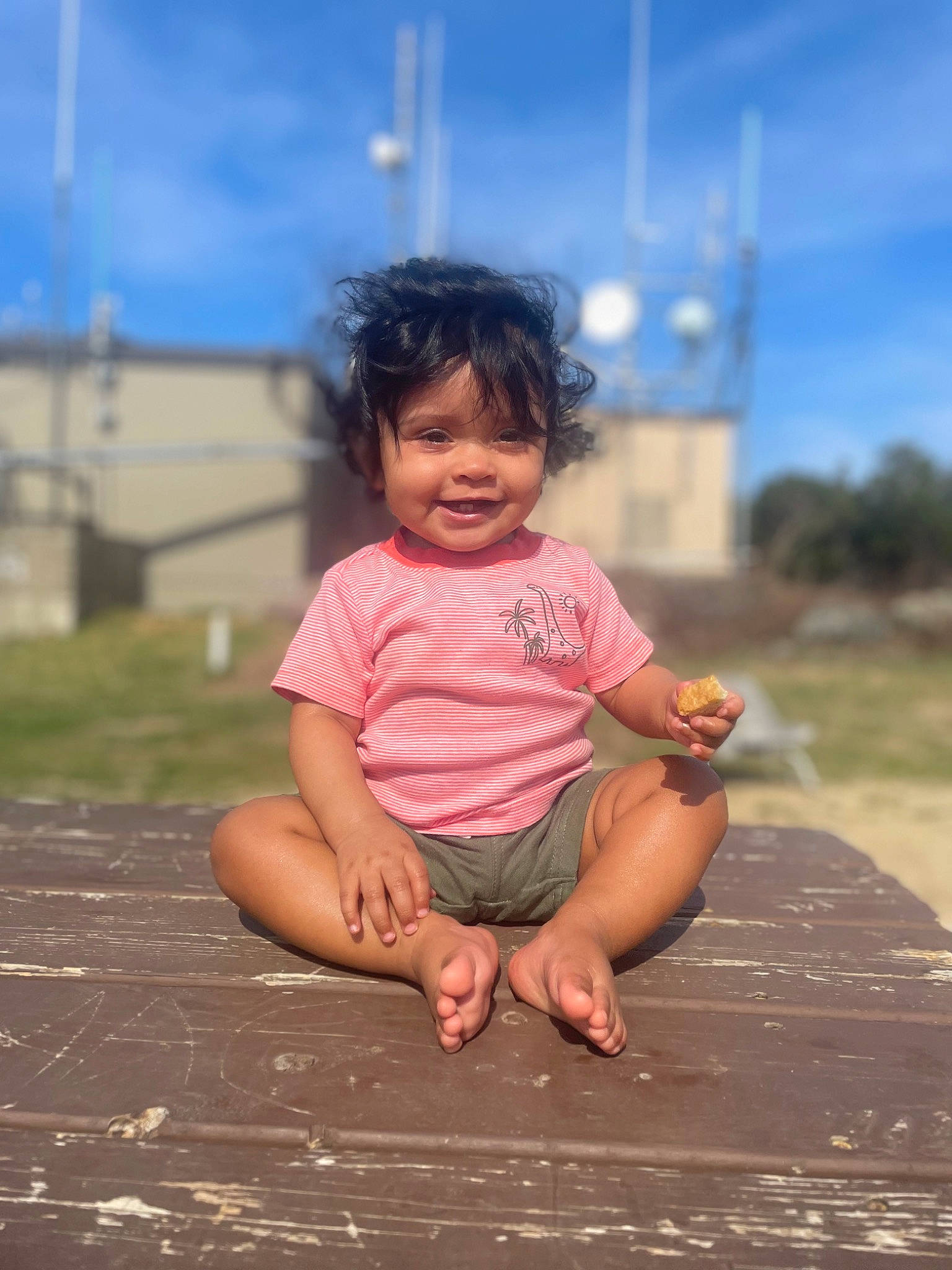 Lyra is registered to the contest to win money with this photo: baby_toddler_clothing, barefoot, child, cloud, foot, fun, grass, happy, human_leg, joy, landscape, leisure, magenta, person, recreation, sitting, skin, sky, smile, soil