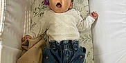 Odette joined the competition — help win amazing prizes! baby, bassinet, blanket, blue_jeans, brown_booties, clothing, cozy, cute, face, footwear, infant, knitted_blanket, lying_down, onesie, patterned_clothing, person, resting, soft, white_bassinet, young_child