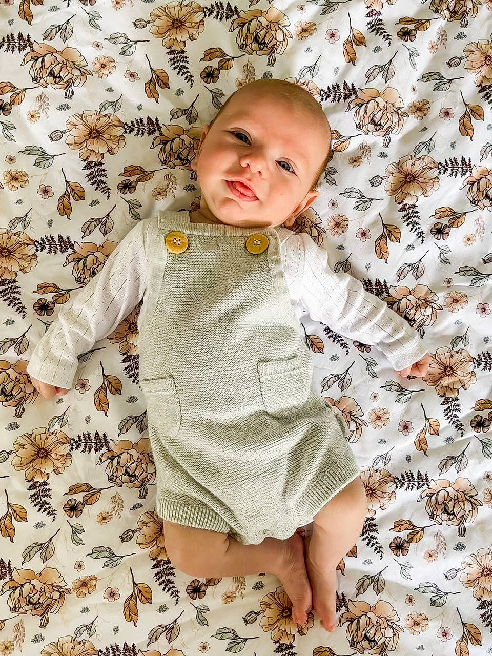 Arlo is registered to the contest to win money with this photo: baby, baby_toddler_clothing, child, collar, comfort, day_dress, face, happy, head, linens, pattern, people_in_nature, person, product, skin, sleeve, t_shirt, textile, toddler, white