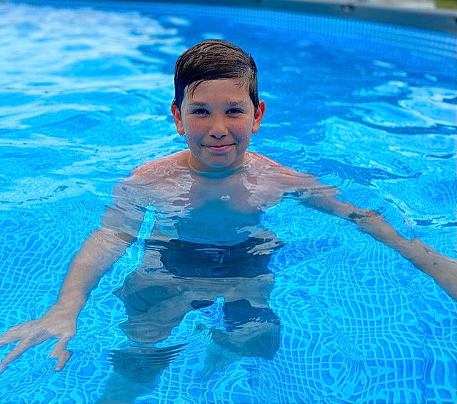 Triston is registered to the contest to win money with this photo: aqua, azure, bathing, blue, chest, child, electric_blue, fluid, fun, games, happy, joy, leisure, leisure_centre, muscle, outdoor_recreation, person, recreation, sports, swimmer
