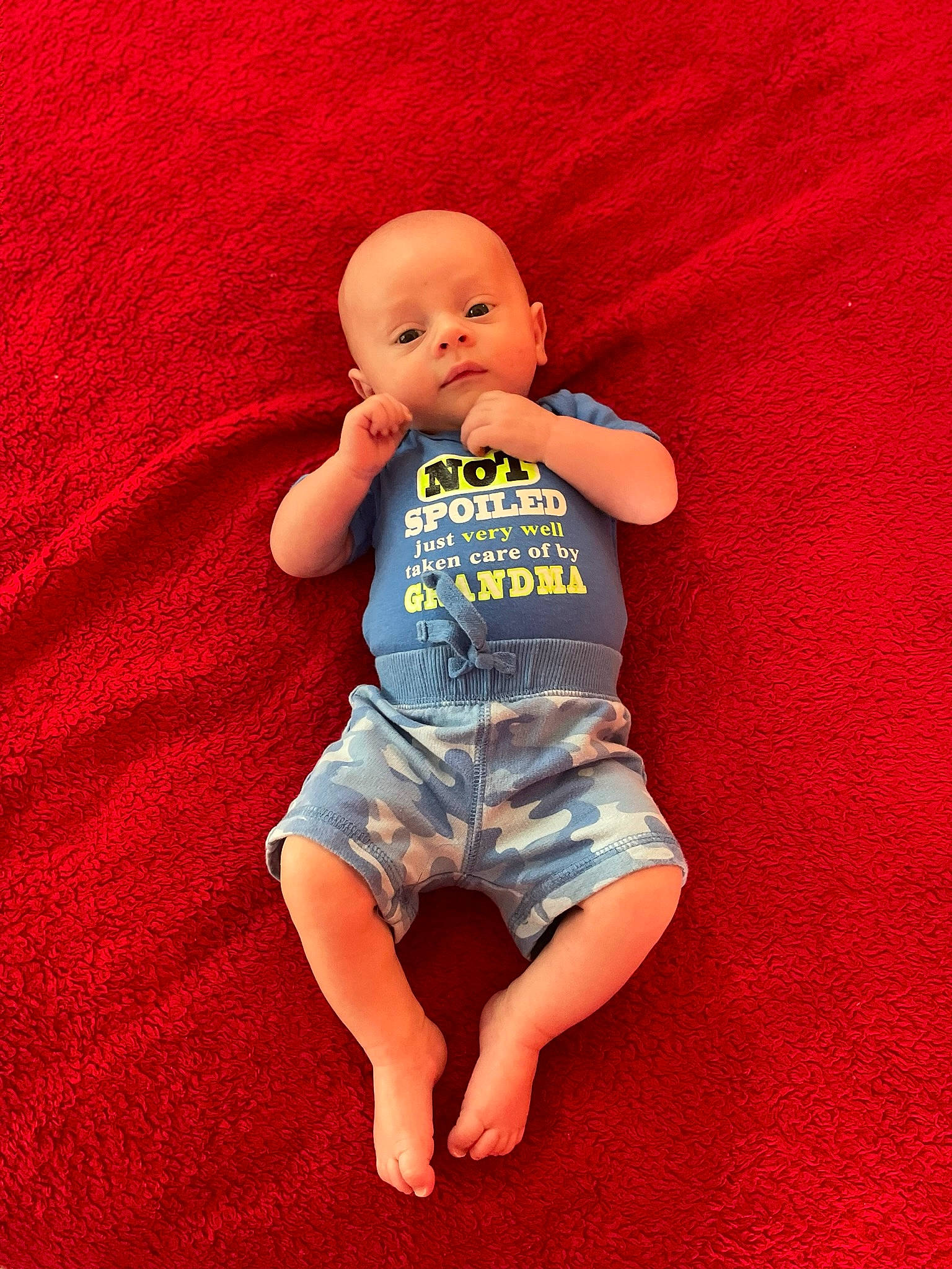 Carsten is registered to the contest to win money with this photo: baby, baby_toddler_clothing, barefoot, cheek, chin, electric_blue, eye, flooring, fun, happy, head, human_body, human_leg, jeans, orange, person, skin, sleeve, t_shirt, textile