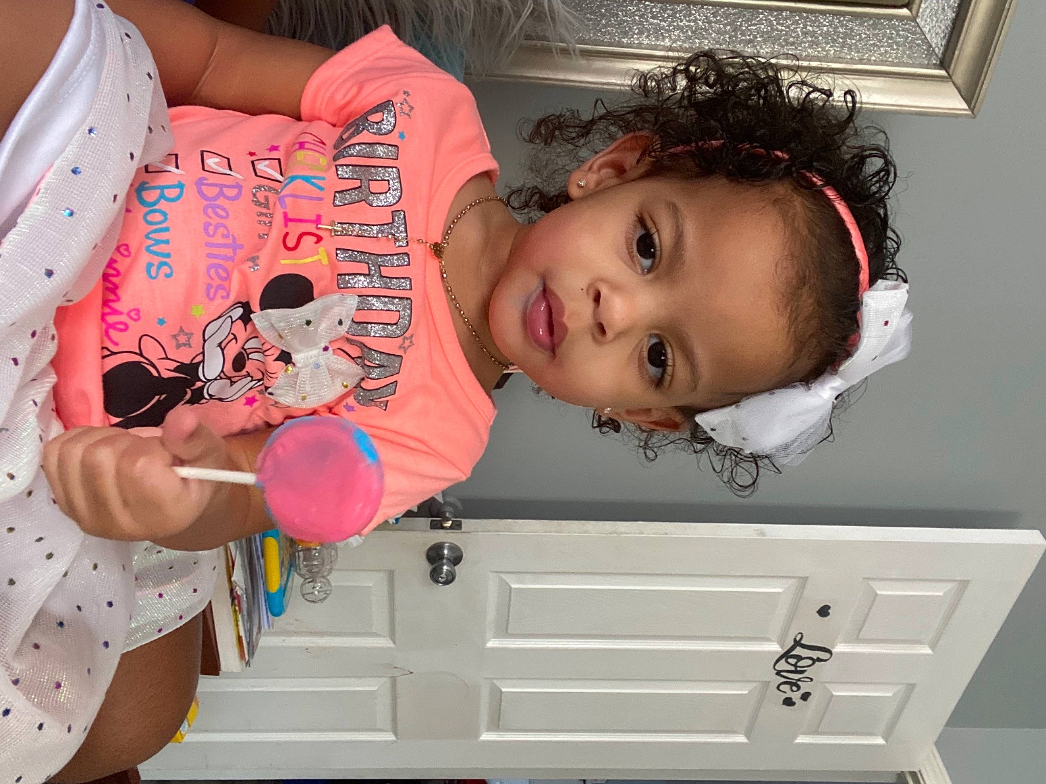 Ulani is registered to the contest to win money with this photo: baby, baby_products, baby_toddler_clothing, balloon, cheek, child, eyelash, facial_expression, fun, happy, magenta, organ, party, person, pink, product, room, skin, t_shirt, toddler