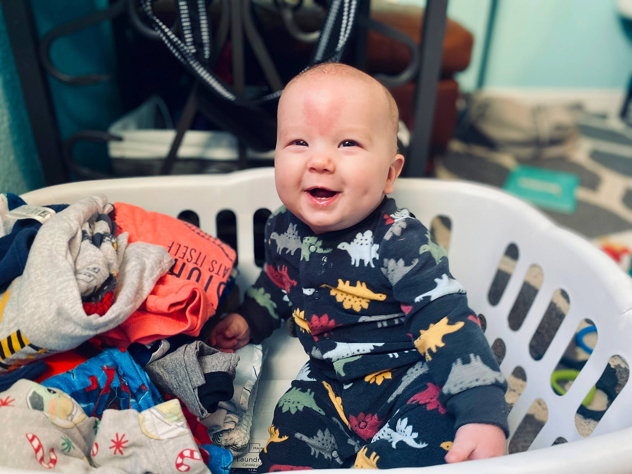 Deacan is registered to the contest to win money with this photo: baby, baby_products, baby_toddler_clothing, carmine, chair, cheek, child, comfort, event, facial_expression, fun, hairstyle, happy, person, room, sitting, skin, sleeve, smile, t_shirt