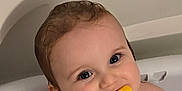 Charles joined the competition — help win amazing prizes! baby, child, bathtub, water, toy, yellow_toy, smile, wet_hair, face, skin, eyes, chewing, sitting, indoor, cute, happy, bath, childhood, play, closeup