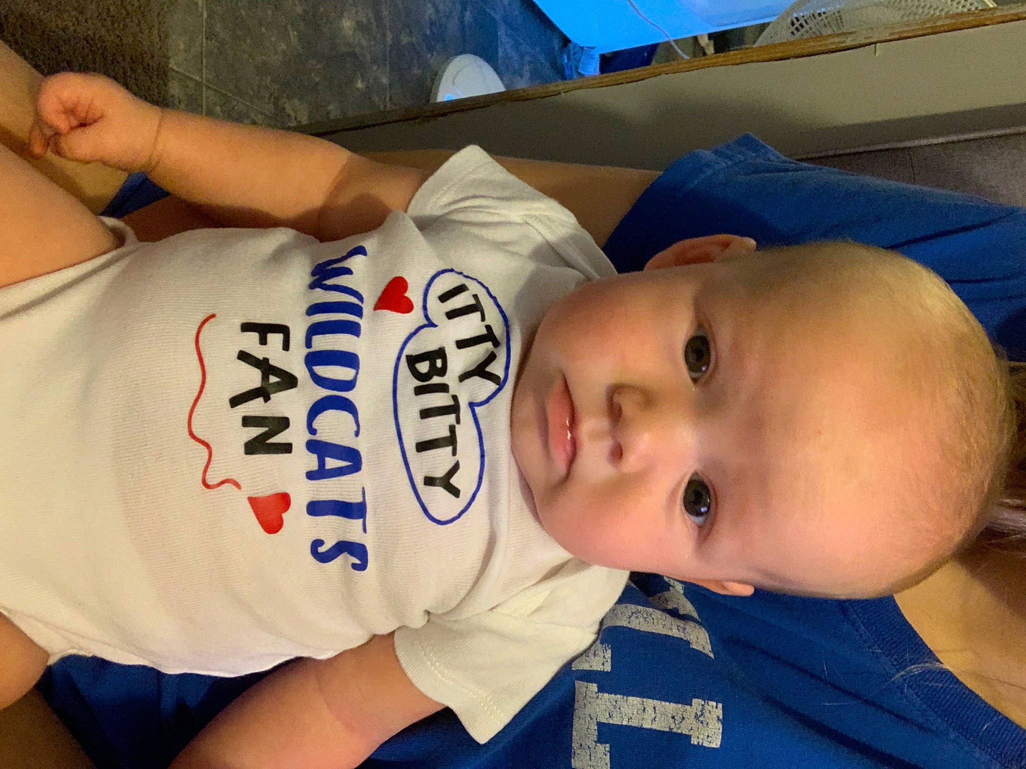Braxton is registered to the contest to win money with this photo: baby, baby_toddler_clothing, blue, cheek, chest, child, chin, comfort, elbow, electric_blue, hat, human_leg, mouth, nose, person, skin, sleeve, thigh, toddler, trunk