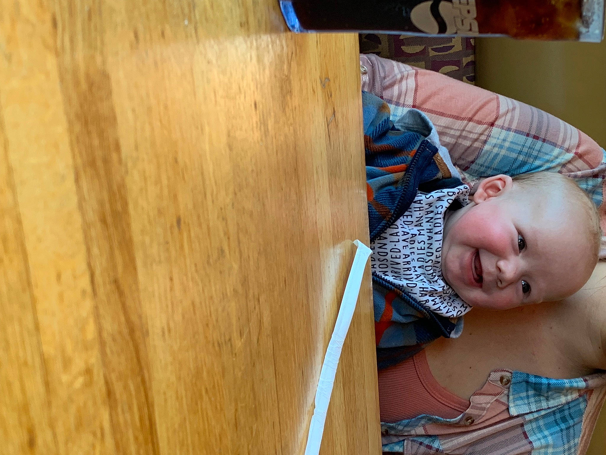 Braxton is registered to the contest to win money with this photo: baby, baby_toddler_clothing, child, comfort, couch, floor, flooring, happy, hardwood, leisure, pattern, person, plank, plywood, room, sitting, toddler, varnish, wood, wood_flooring