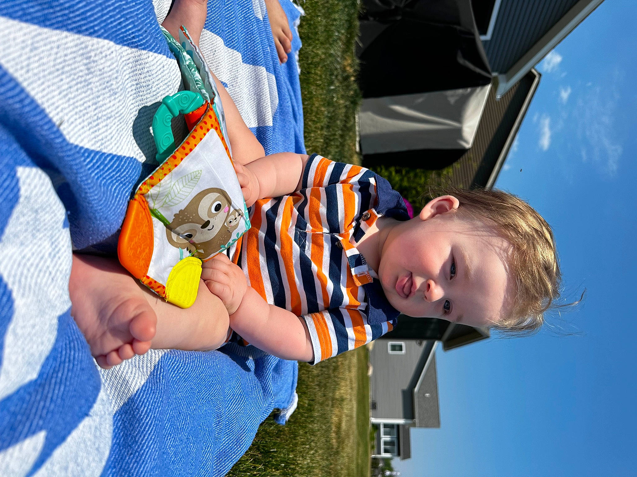 Preston is registered to the contest to win money with this photo: baby, baby_products, baby_toddler_clothing, blue, child, cloud, electric_blue, fun, grass, happy, leisure, pattern, people_in_nature, person, play, recreation, sky, t_shirt, toddler, travel