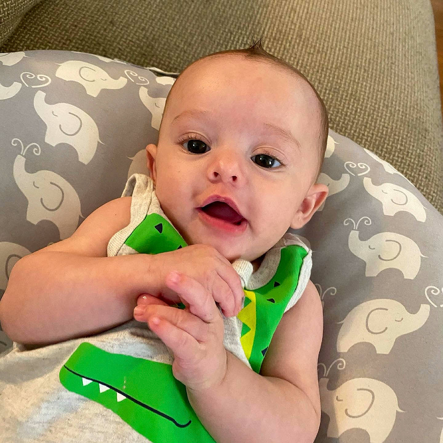 Wyatt is registered to the contest to win money with this photo: baby, baby_toddler_clothing, cheek, comfort, ear, eyebrow, gesture, hair, happy, head, human_body, iris, lip, mouth, neck, nose, person, skin, sleeve, smile