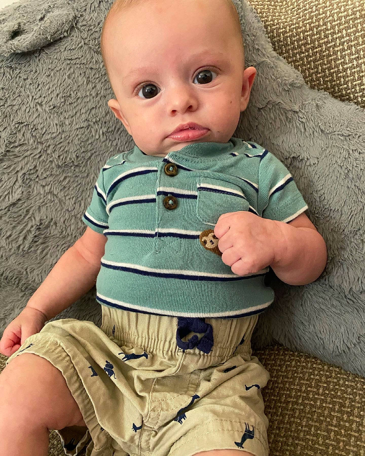 Wyatt is registered to the contest to win money with this photo: baby, baby_toddler_clothing, cheek, comfort, cool, eye, finger, head, iris, lip, neck, nose, organ, person, photograph, skin, sleeve, t_shirt, textile, toddler