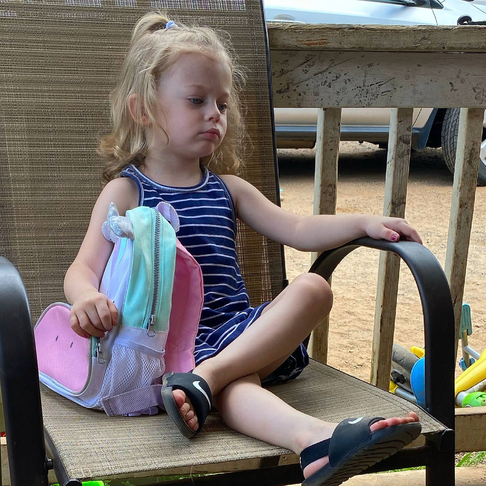 Delylah is registered to the contest to win money with this photo: baby_toddler_clothing, eye, facial_expression, fun, grass, hairstyle, happy, human_body, joint, knee, lap, leg, leisure, outdoor_furniture, person, shoe, sock, summer, thigh, toddler