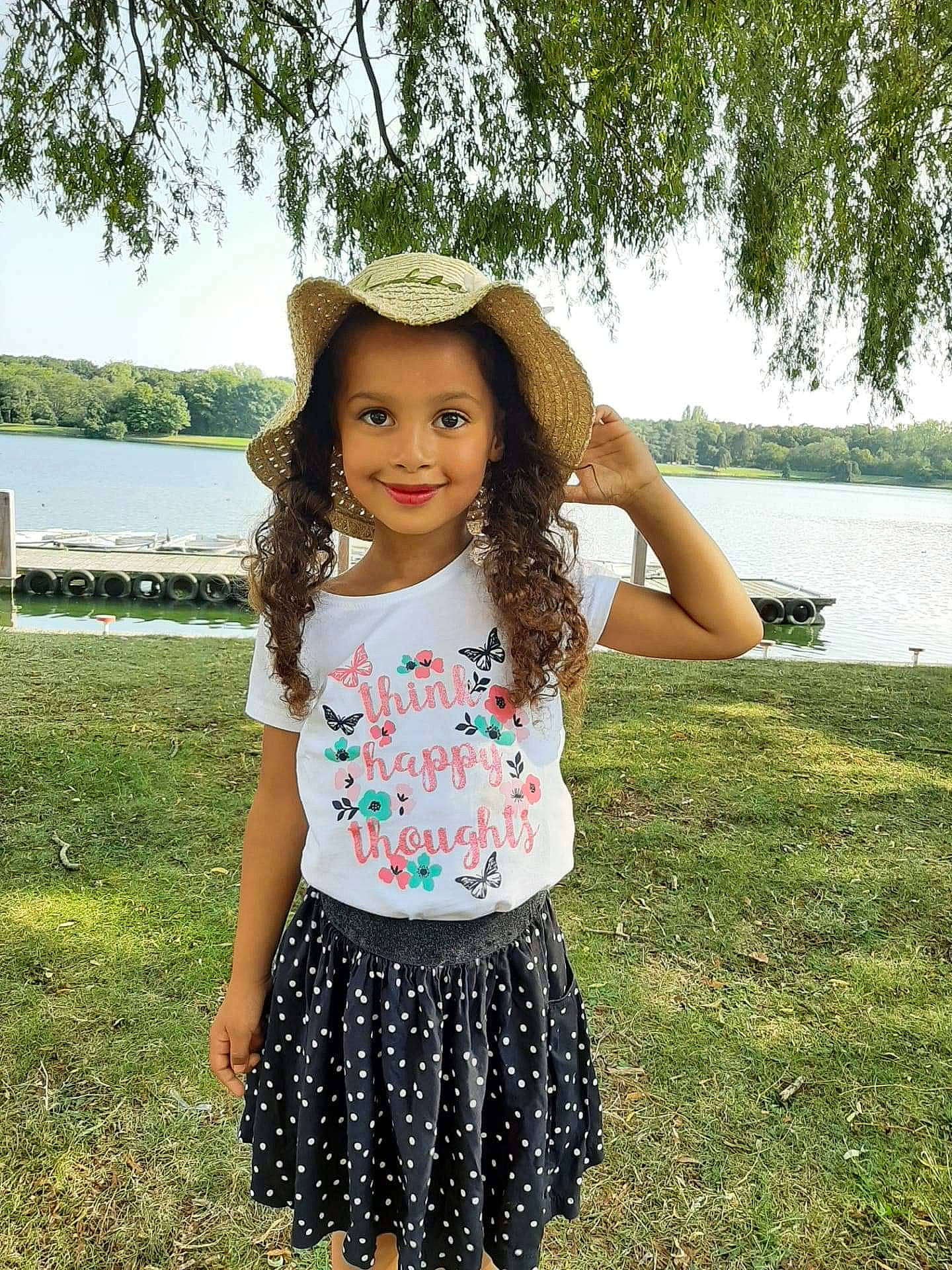 Aicha participe au concours pour gagner de l'argent avec cette photo : baby_toddler_clothing, child, child_model, clothing, design, dress, grass, green, headgear, joy, leaf, long_hair, pattern, person, pink, smile, spring, summer, textile, toddler