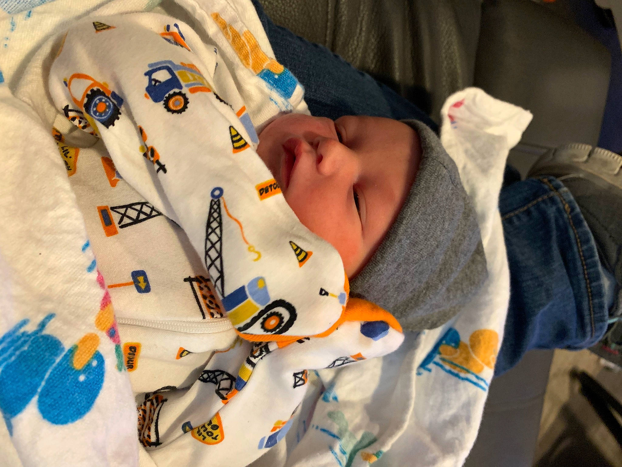 Greysen is registered to the contest to win money with this photo: baby, baby_products, baby_sleeping, baby_toddler_clothing, blanket, button, carmine, child, comfort, fashion_accessory, headwear, linens, nap, pattern, person, plush, room, sleep, sleeve, t_shirt