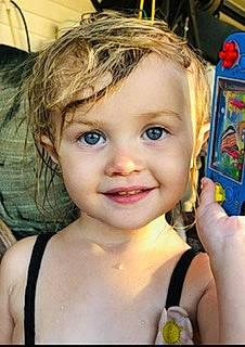 Lillian is registered to the contest to win money with this photo: blond, cheek, chest, child, chin, electric_blue, eyebrow, eyelash, finger, forehead, fun, gesture, happy, iris, joy, lip, mouth, nose, person, skin